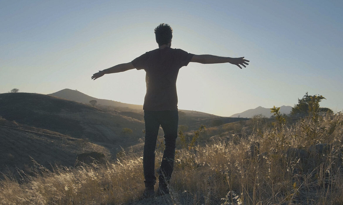 man enjoying the wind